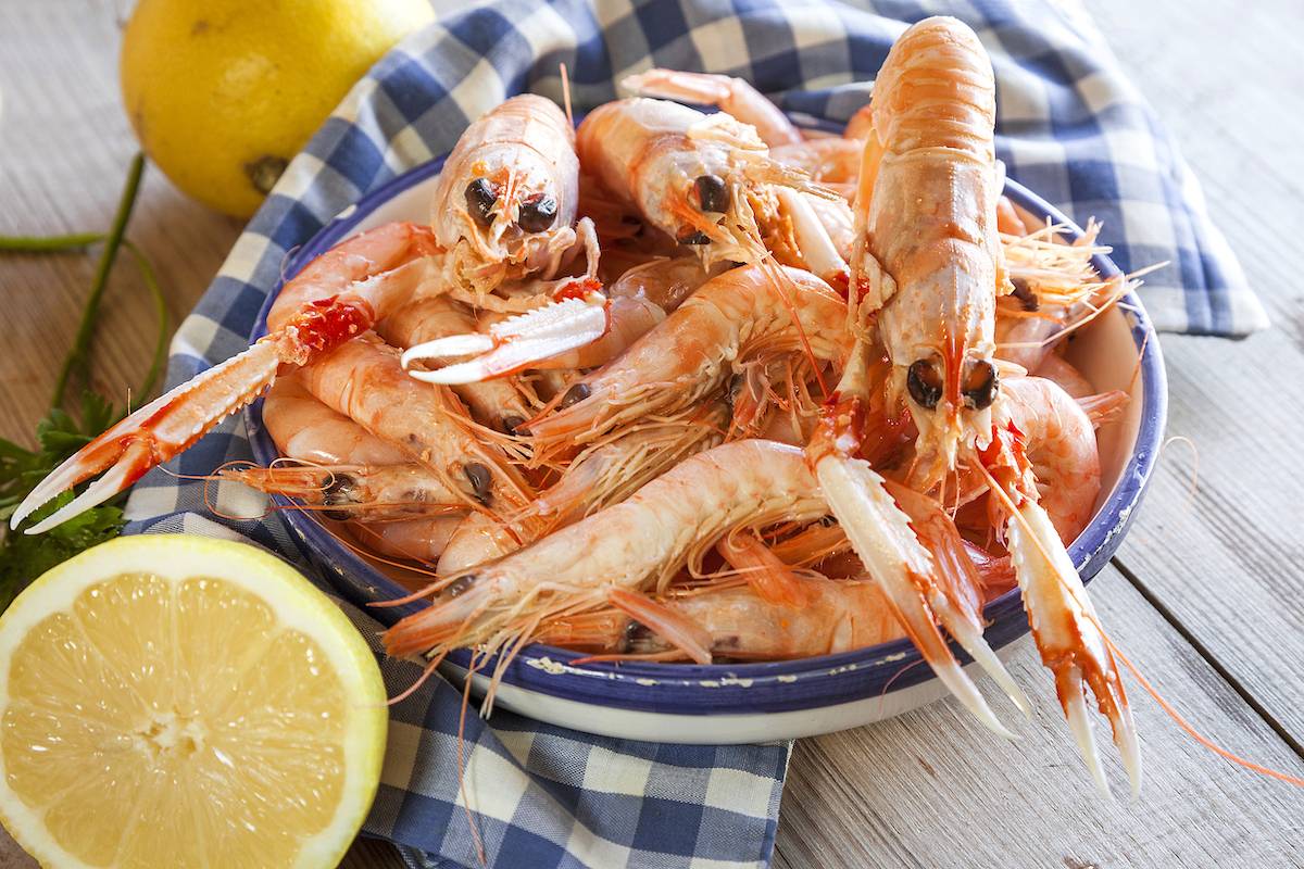 Cassolette de langoustines et noix de Saint-Jacques aux agrumes et safran.